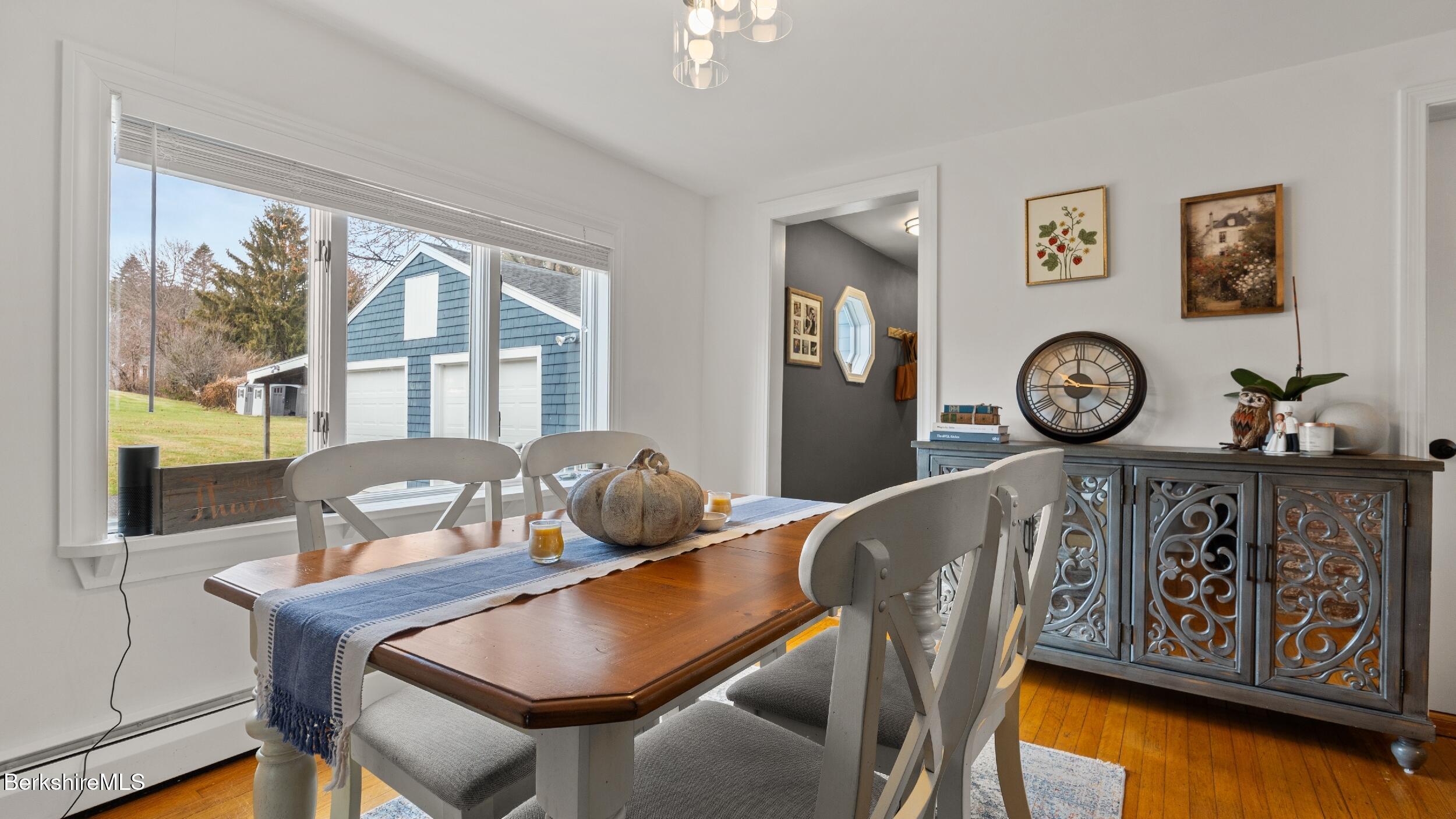 8 Catherine Street Lenox, MA 01242 - Photo 13 of 52 a view of a dining room with furniture window and wooden floor