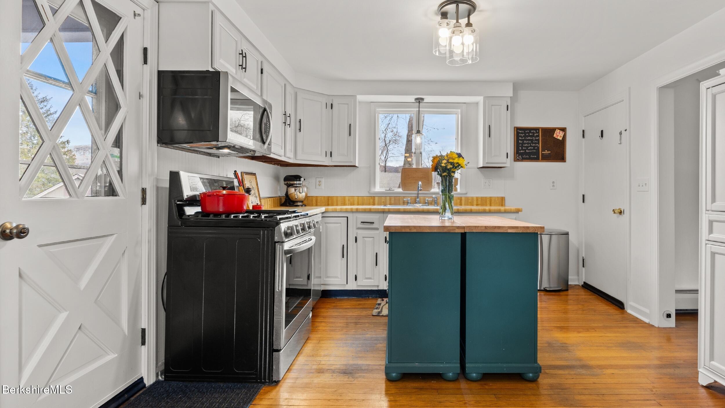 8 Catherine Street Lenox, MA 01242 - Photo 16 of 52 a kitchen with stainless steel appliances a refrigerator sink and cabinets