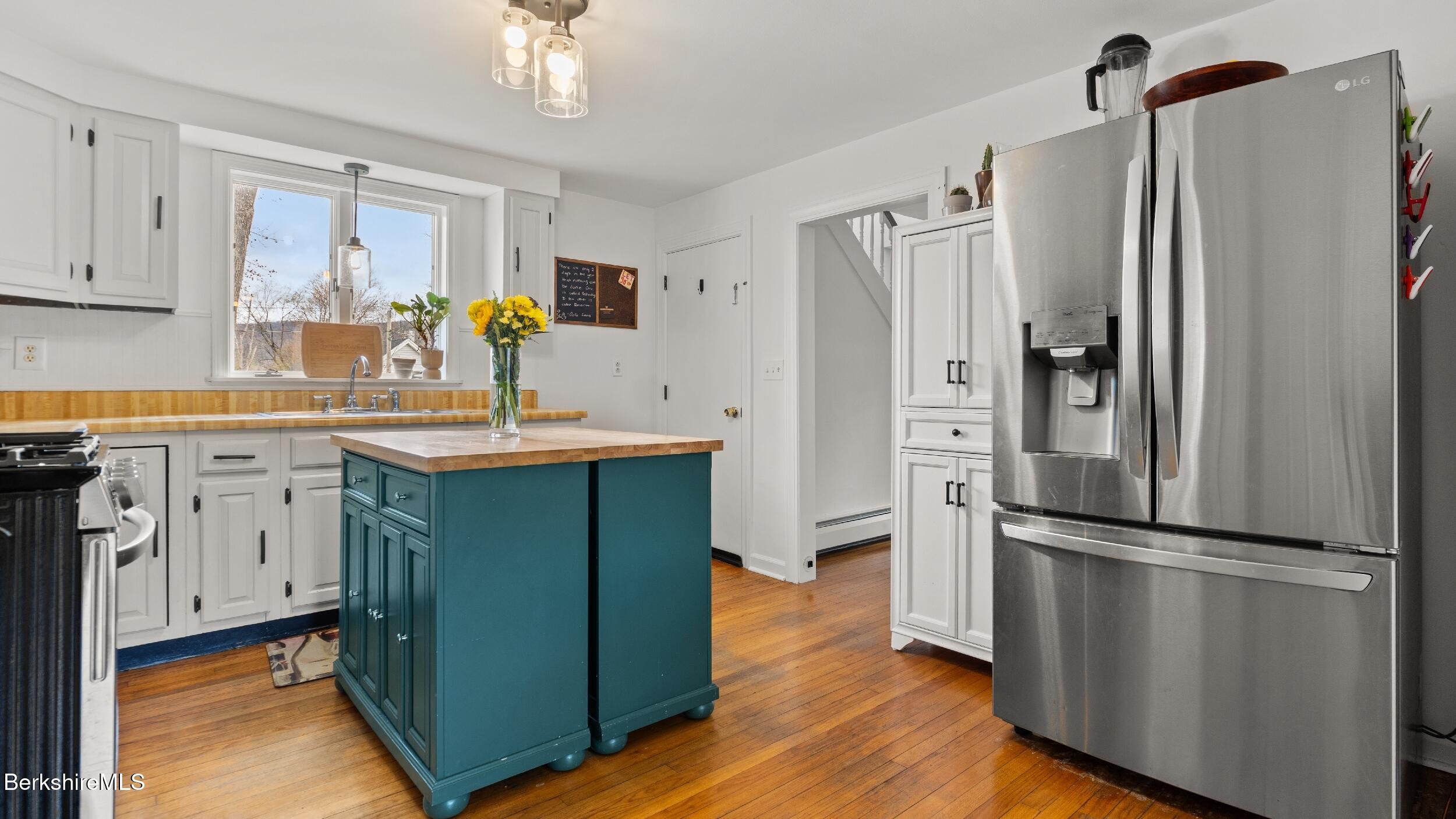8 Catherine Street Lenox, MA 01242 - Photo 18 of 52 a kitchen with stainless steel appliances a refrigerator sink and cabinets
