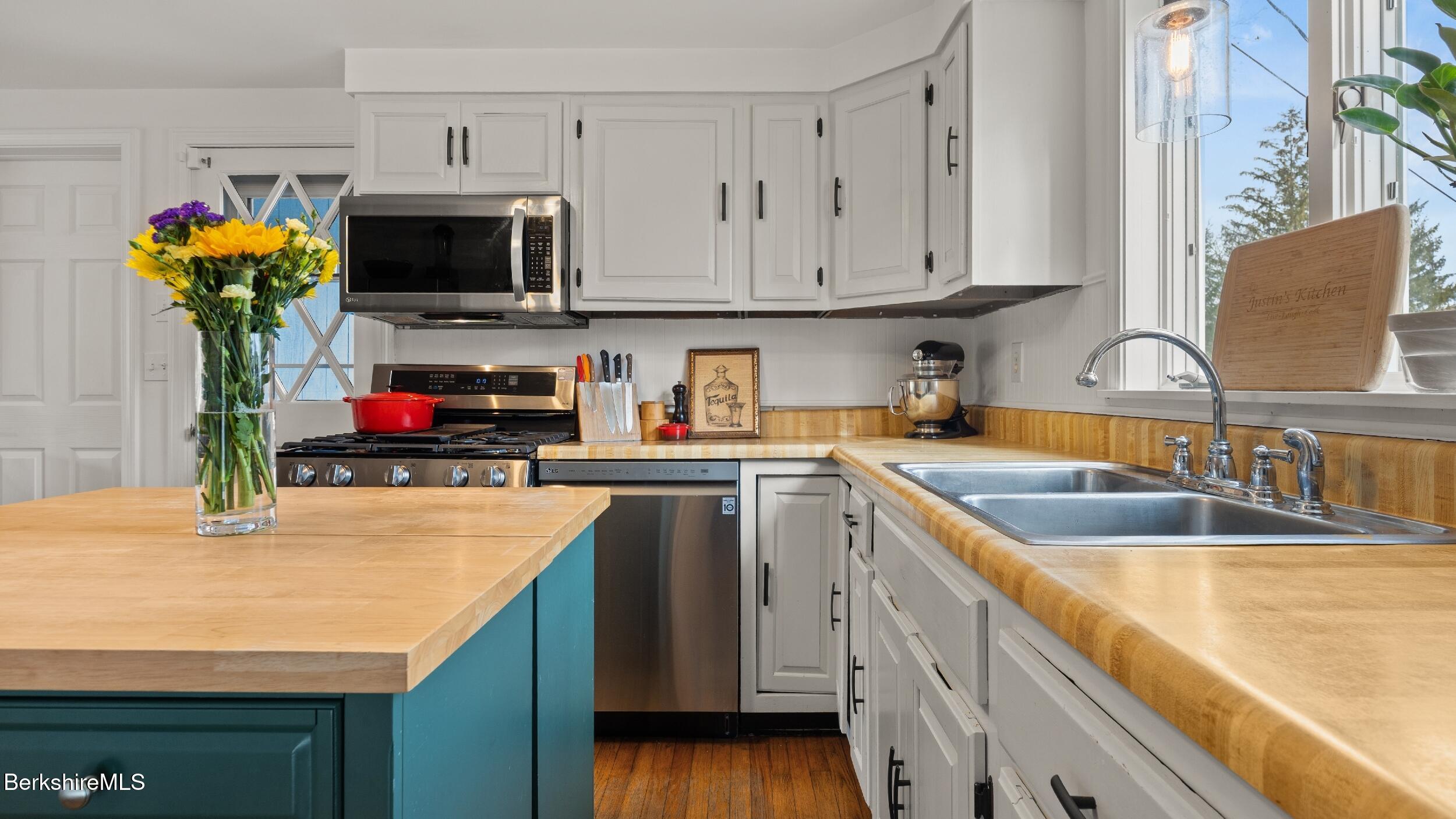 8 Catherine Street Lenox, MA 01242 - Photo 20 of 52 a kitchen with stainless steel appliances granite countertop a sink and a microwave