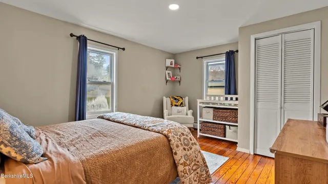 a bedroom with a bed and a cabinets