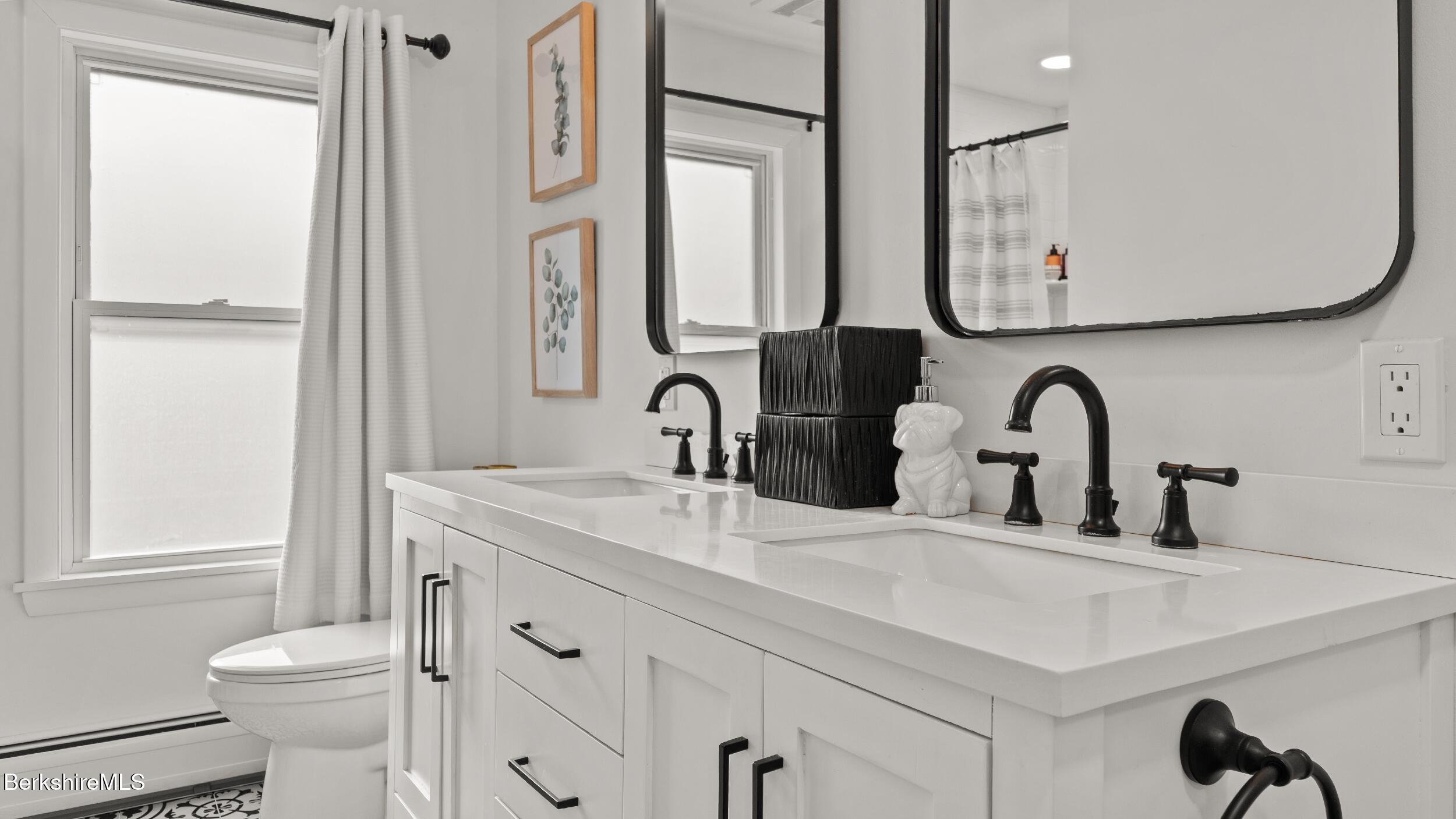 8 Catherine Street Lenox, MA 01242 - Photo 31 of 52 a bathroom with a sink vanity toilet and a mirror