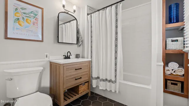 a bathroom with a sink a vanity and a mirror