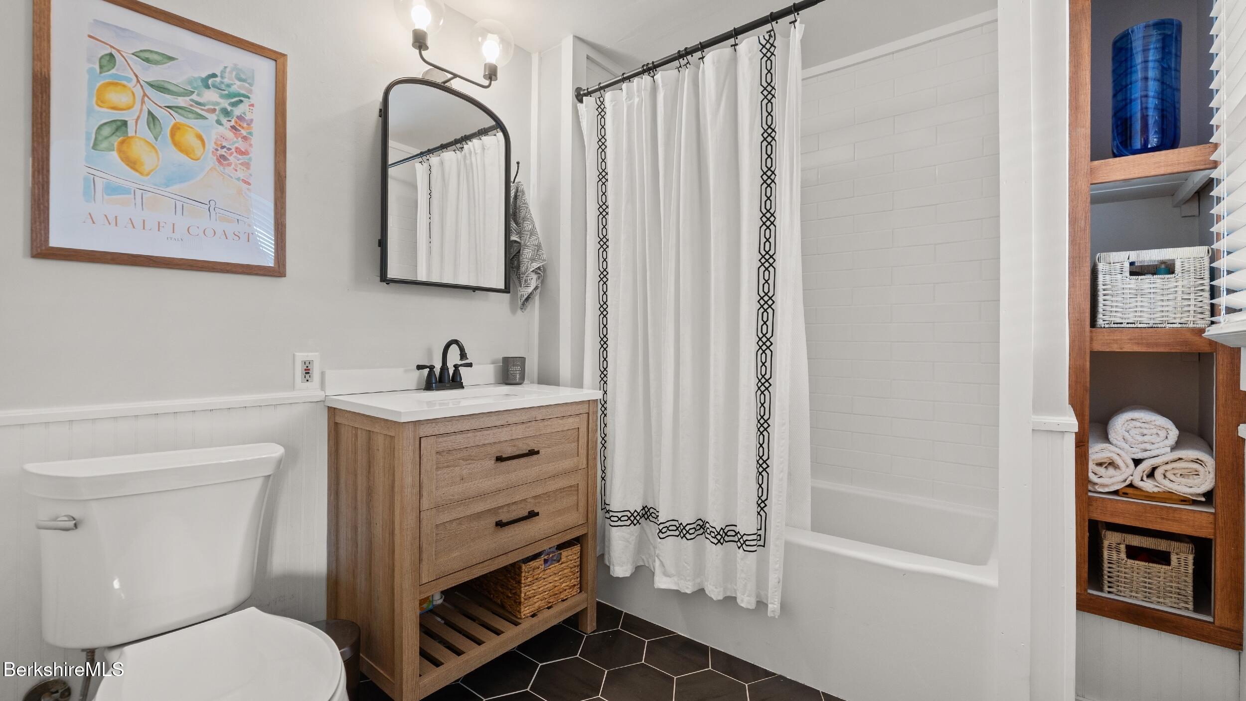 8 Catherine Street Lenox, MA 01242 - Photo 32 of 52 a bathroom with a sink a vanity and a mirror