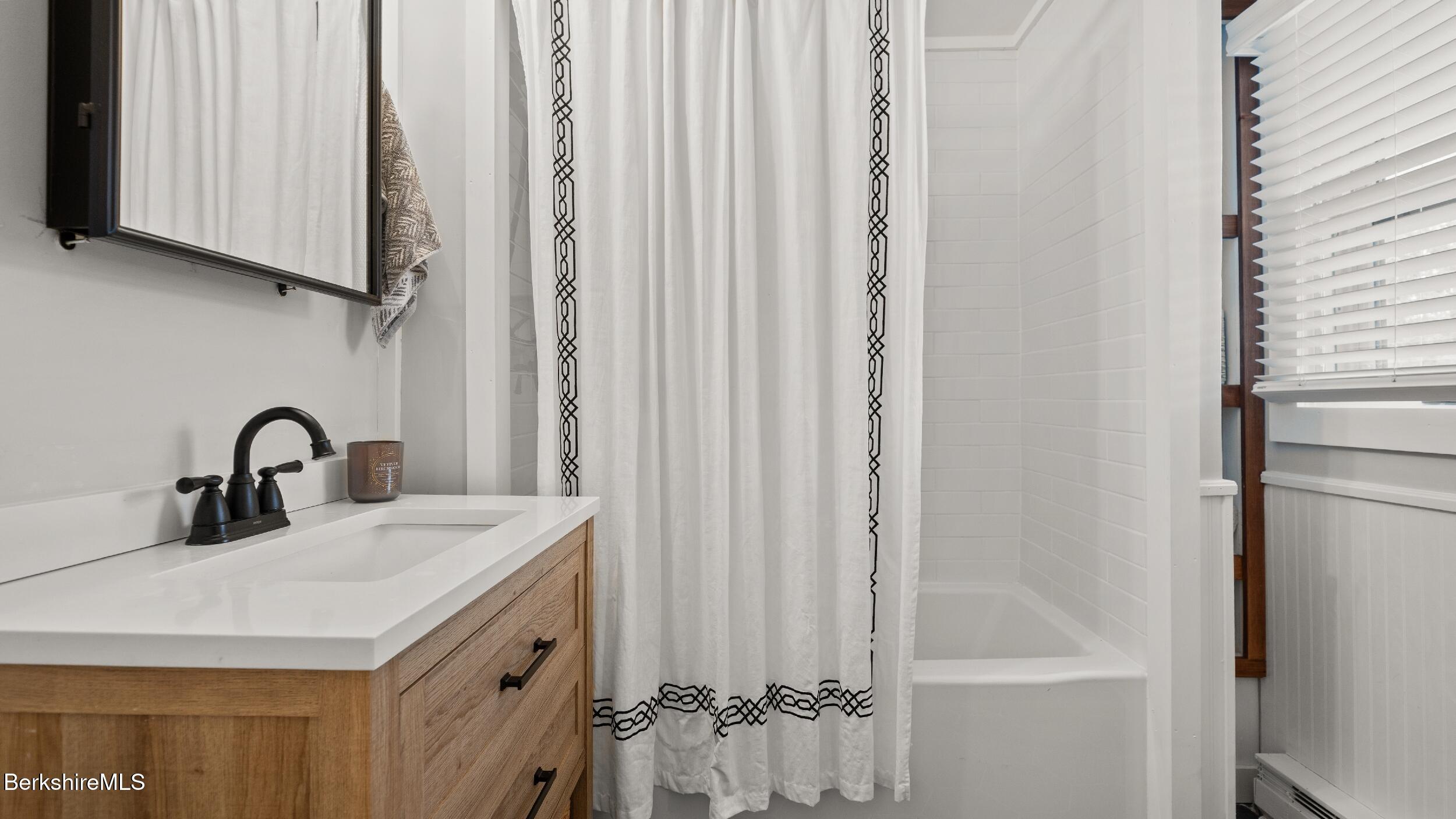 8 Catherine Street Lenox, MA 01242 - Photo 33 of 52 a bathroom with a sink and a mirror