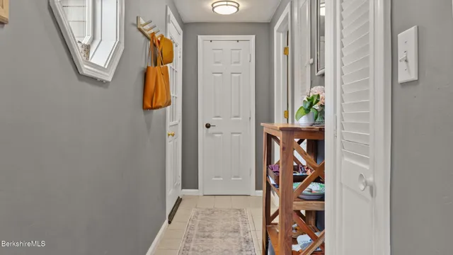 a view of an entryway with wooden floor