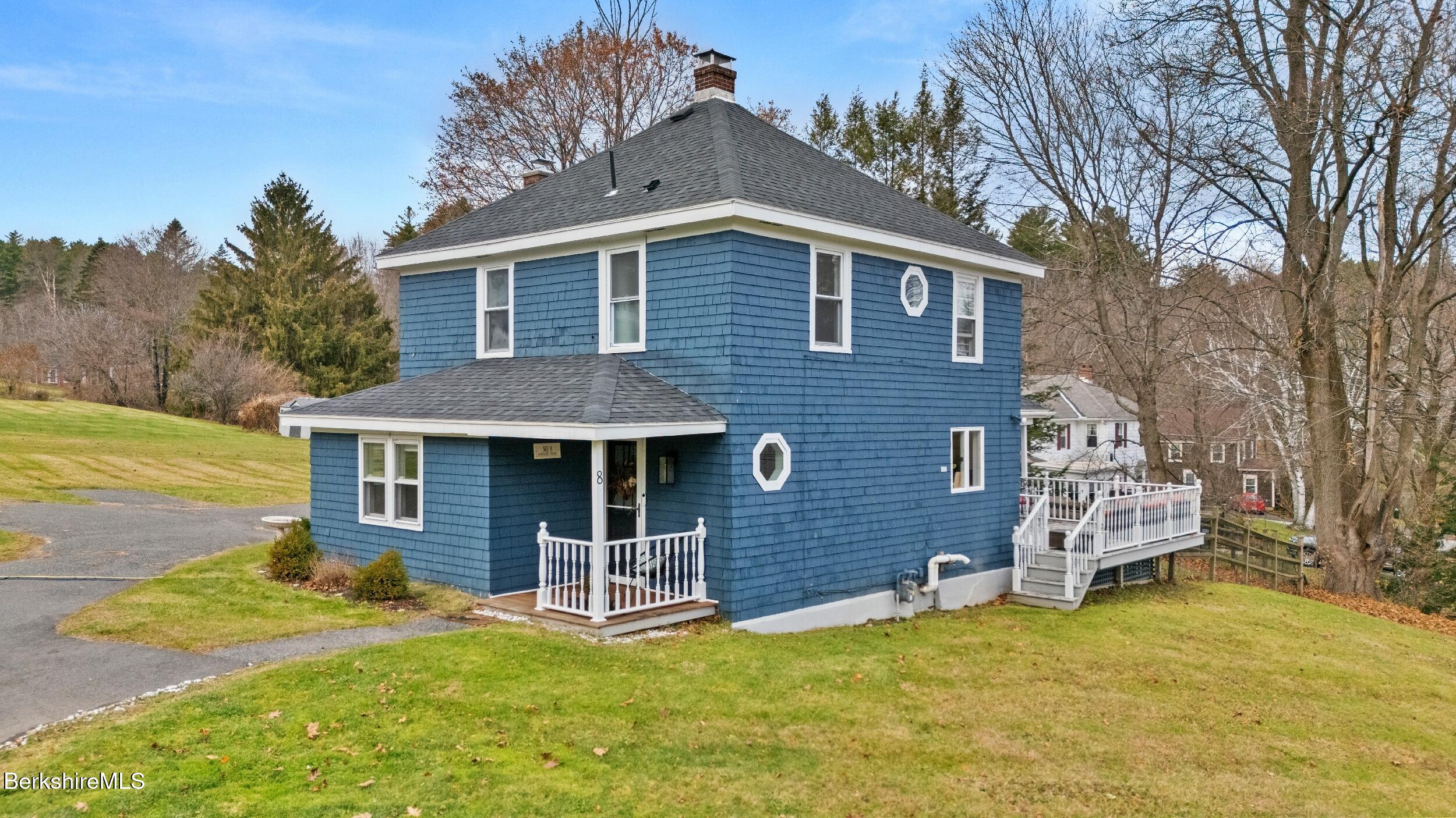 8 Catherine Street Lenox, MA 01242 - Photo 36 of 52 a front view of a house with a yard and garage