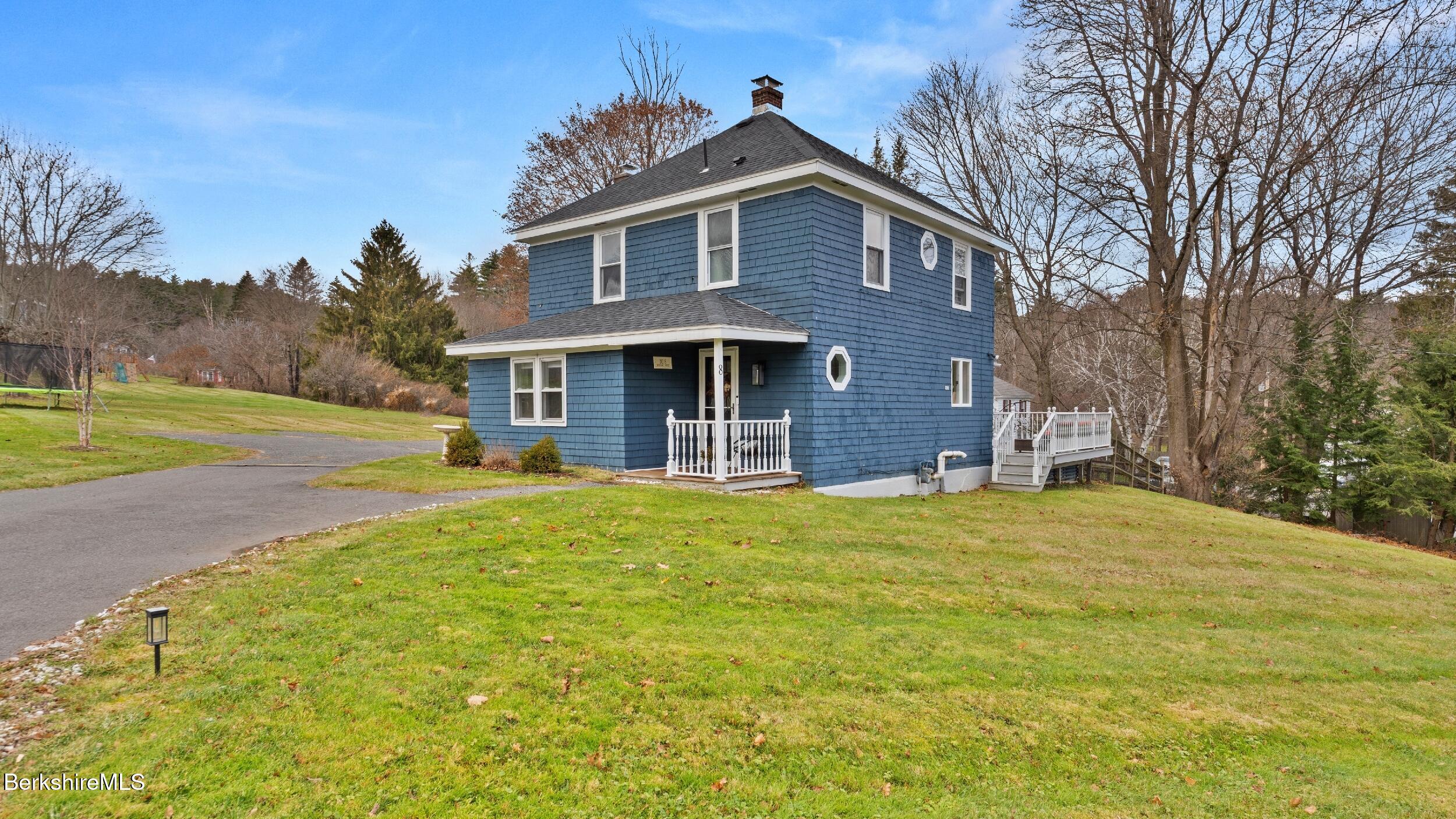 8 Catherine Street Lenox, MA 01242 - Photo 4 of 52 a front view of a house with a yard