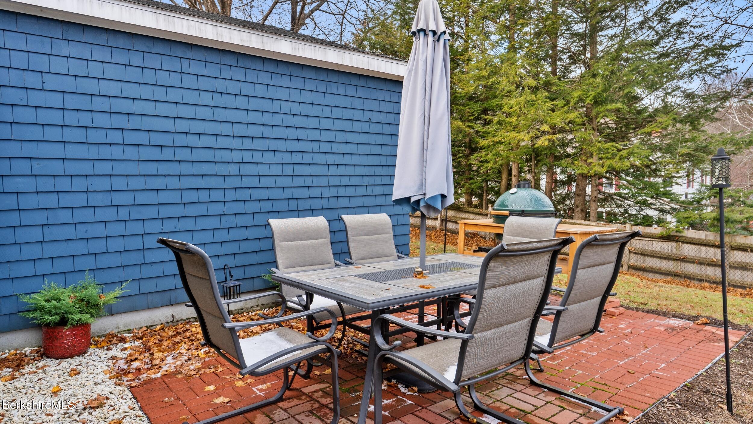 8 Catherine Street Lenox, MA 01242 - Photo 41 of 52 a view of a patio with table and chairs and potted plants