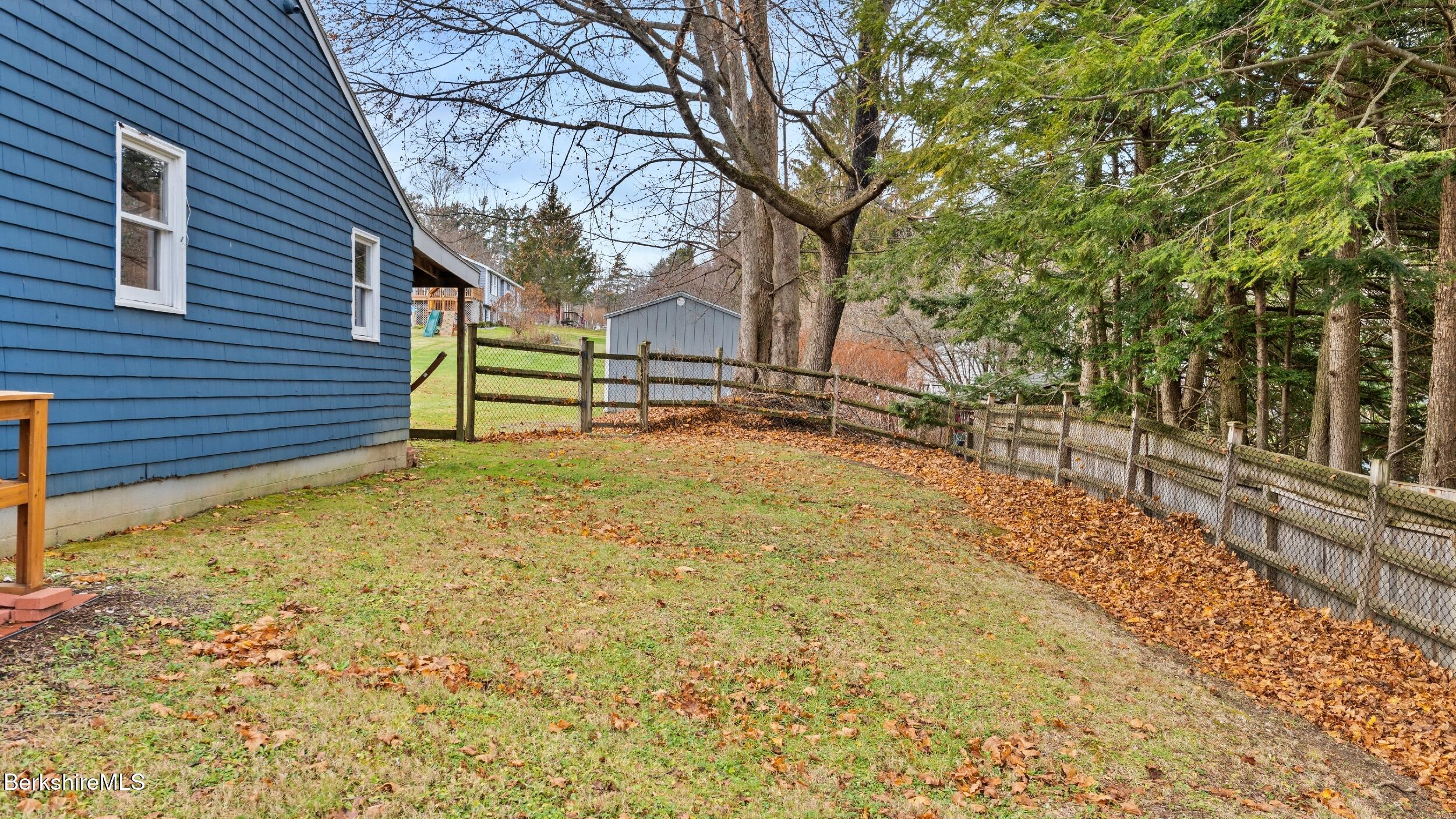 8 Catherine Street Lenox, MA 01242 - Photo 45 of 52 a view of a yard with wooden fence