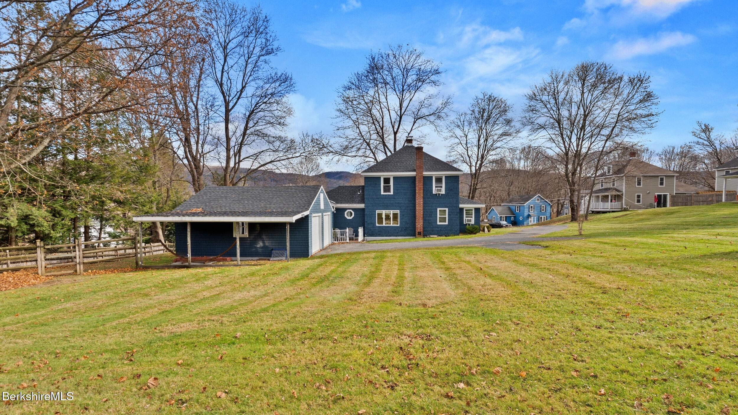 8 Catherine Street Lenox, MA 01242 - Photo 47 of 52 a view of a house with a large trees with a big yard