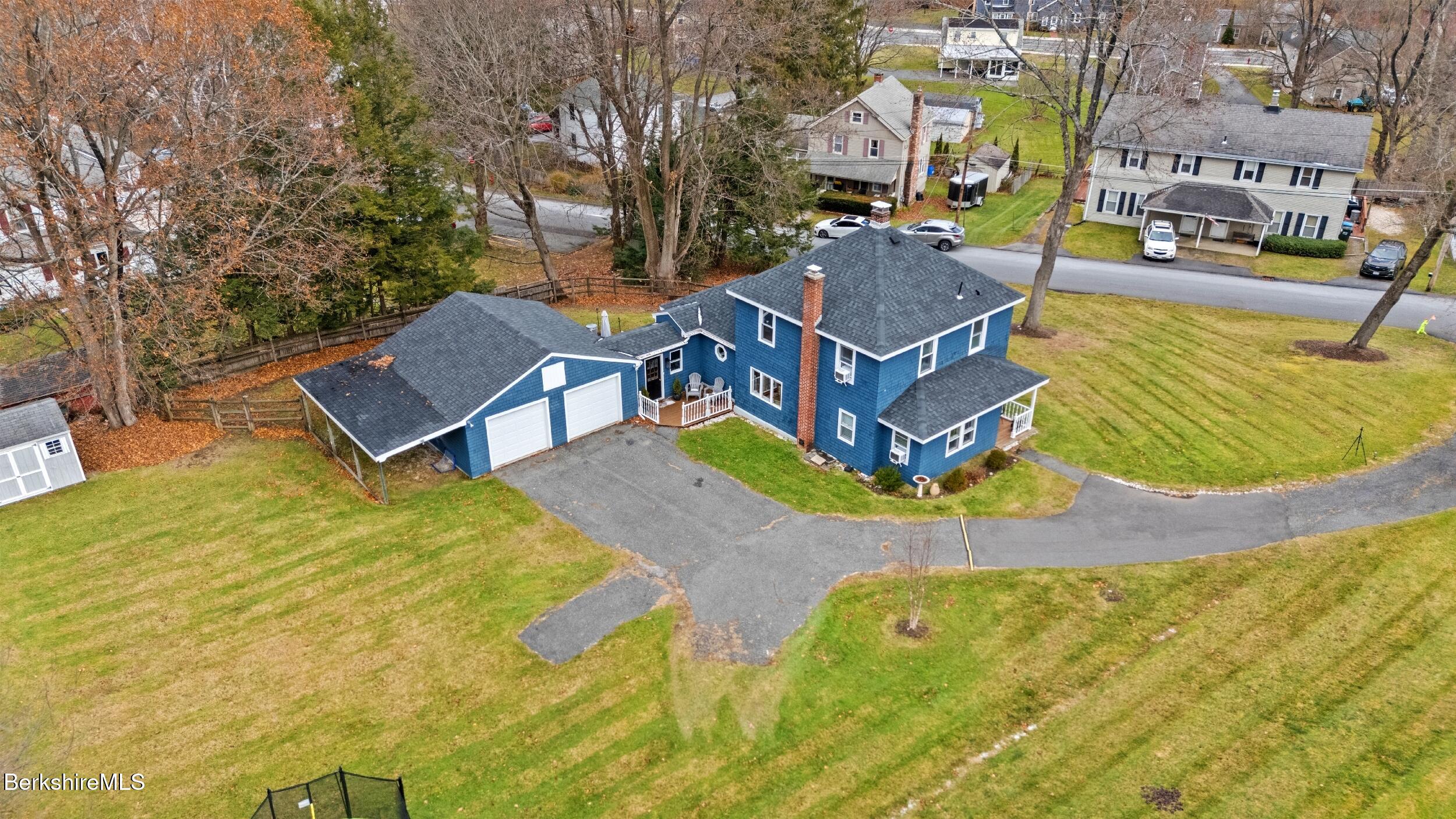 8 Catherine Street Lenox, MA 01242 - Photo 48 of 52 a view of a swimming pool with outdoor seating and yard