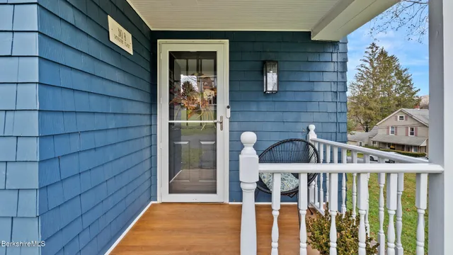 a view of a wooden door and a window