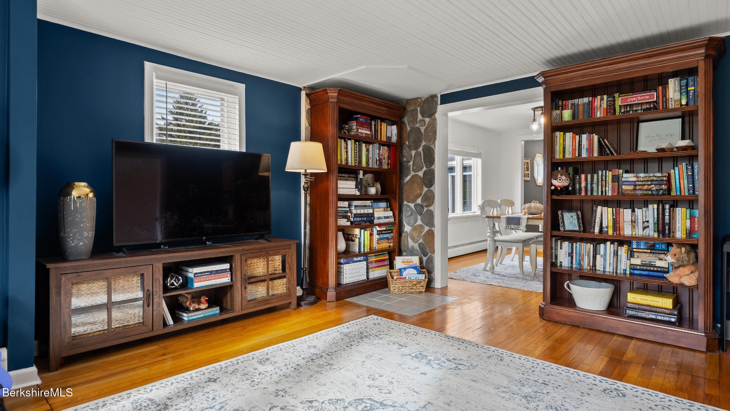 8 Catherine Street Lenox, MA 01242 - Photo 10 of 52 a living room with furniture and a flat screen tv