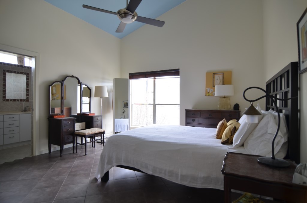 5401 Lillian Street Houston, TX 77007 - Photo 12 of 26 a bedroom with a bed and a a large window