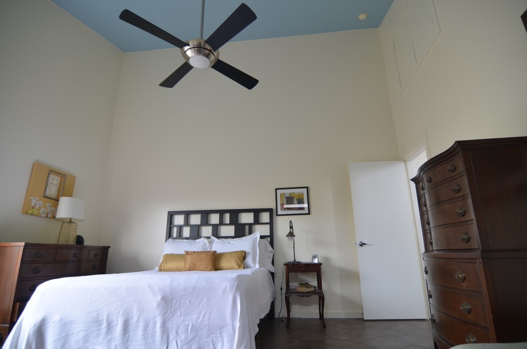 5401 Lillian Street Houston, TX 77007 - Photo 13 of 26 a bedroom with a bed and a refrigerator