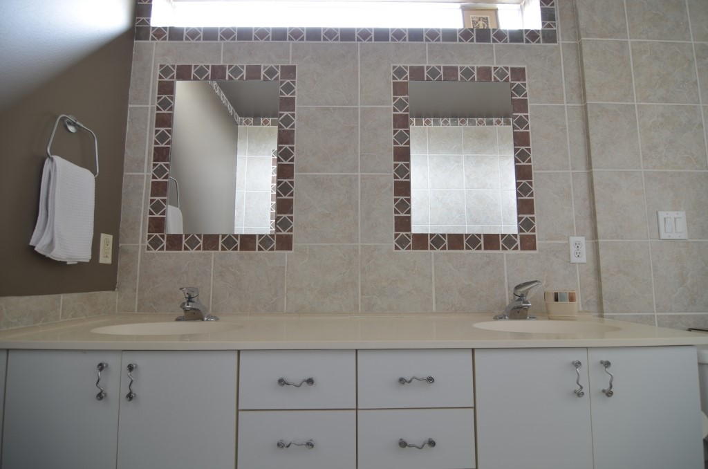 5401 Lillian Street Houston, TX 77007 - Photo 15 of 26 a bathroom with a sink and a mirror