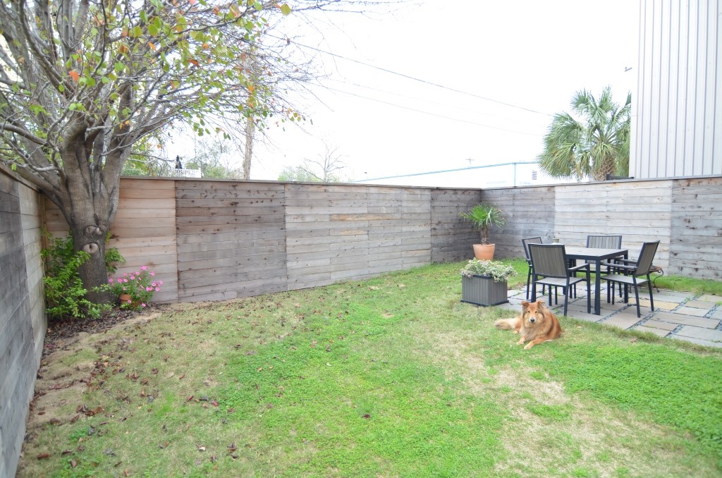 5401 Lillian Street Houston, TX 77007 - Photo 24 of 26 a view of a chair and table in backyard