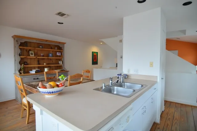 a bathroom with a sink a vanity and a mirror