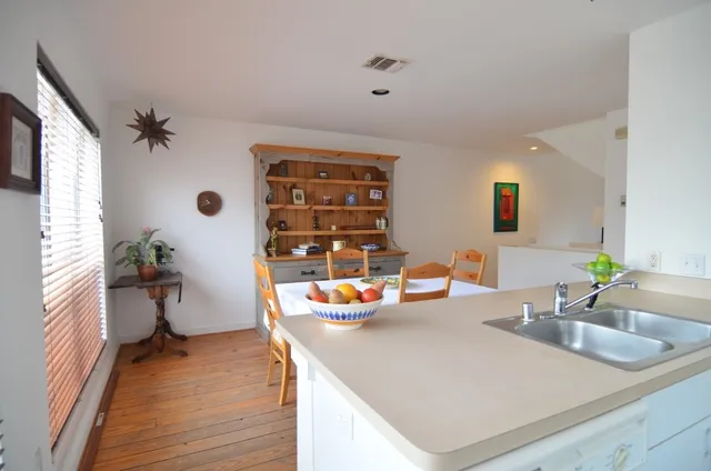 a kitchen with a sink and a stove top oven