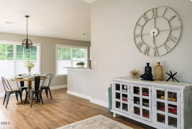 a view of a dining room with furniture window and wooden floor