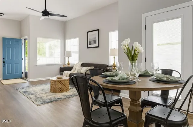 a view of a dining room with furniture and window
