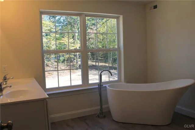 a view of a bathtub in a bathroom