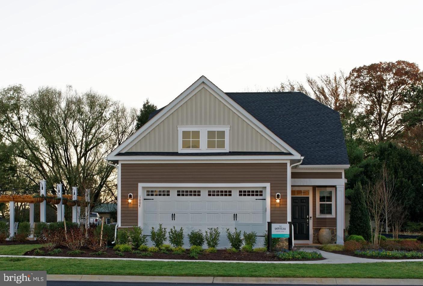 1007 Champlain Court Trappe, MD 21673 - Photo 1 of 54 a front view of a house with a garden