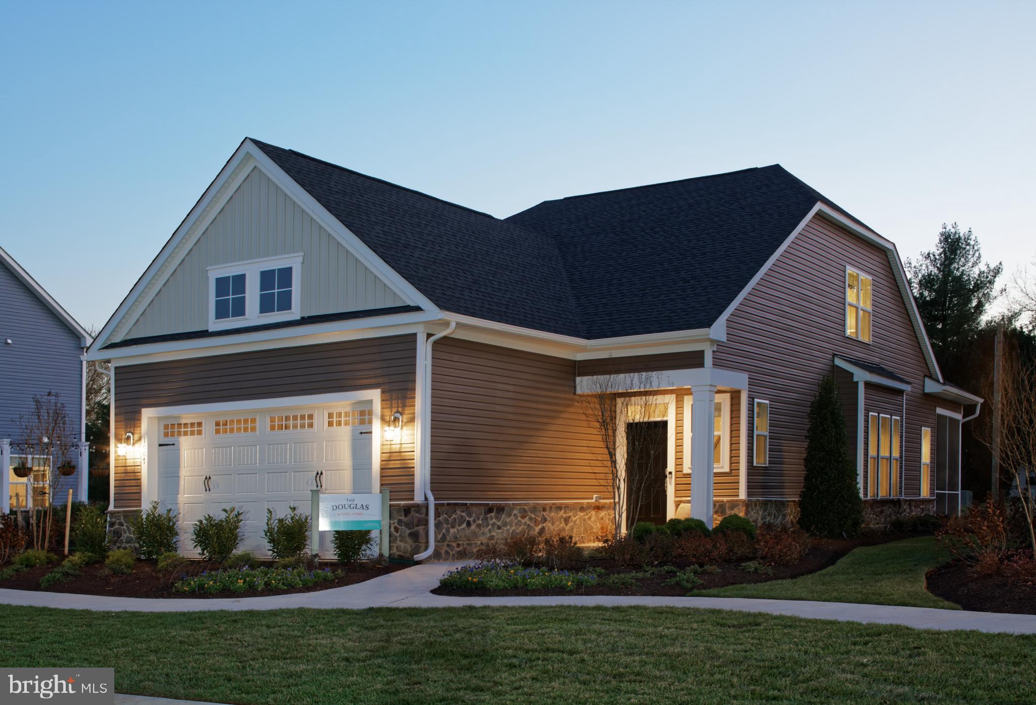 1007 Champlain Court Trappe, MD 21673 - Photo 2 of 54 a front view of a house with garden