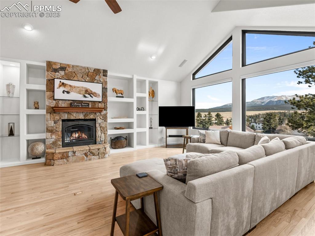 133 Matthew Road Divide, CO 80814 - Photo 2 of 37 a living room with furniture a large window and a flat screen tv