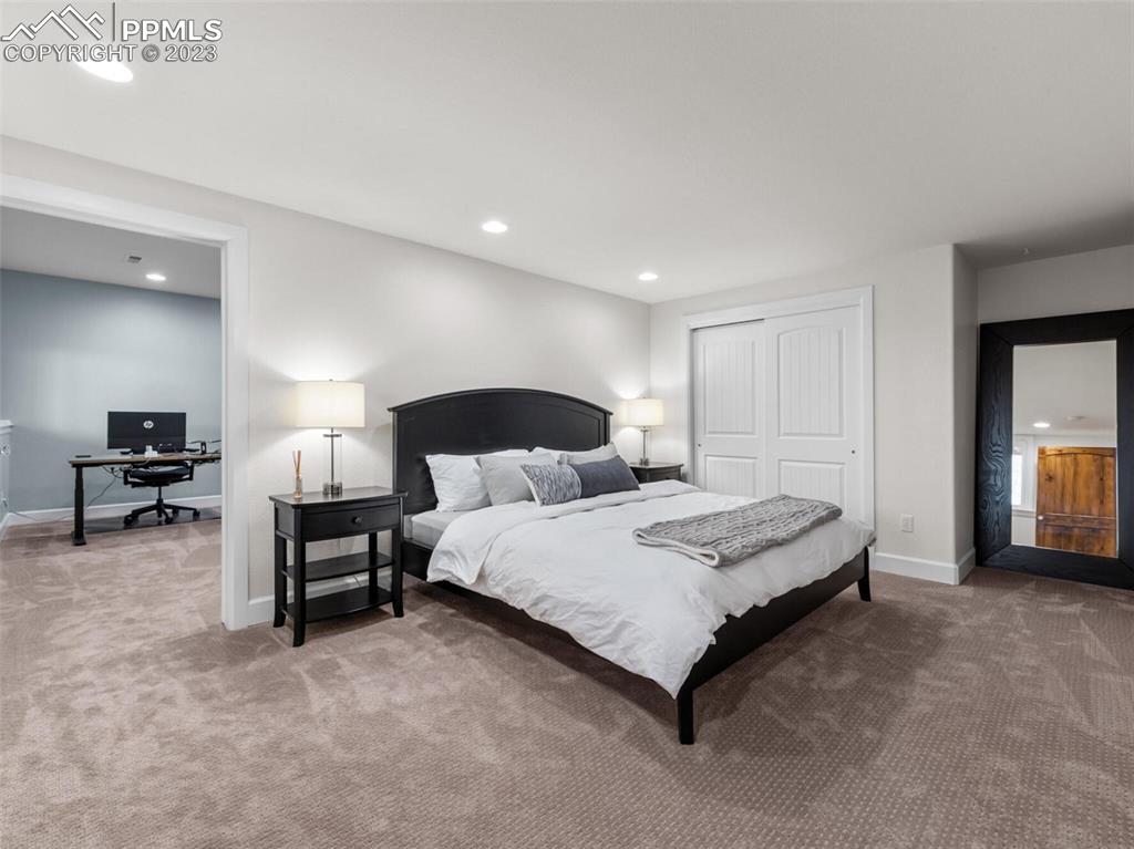 133 Matthew Road Divide, CO 80814 - Photo 24 of 37 a spacious bedroom with a bed and a tv