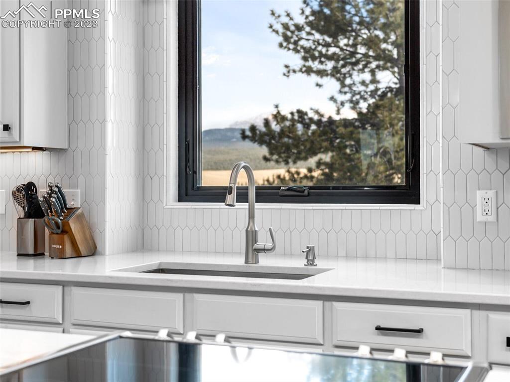 133 Matthew Road Divide, CO 80814 - Photo 4 of 37 a kitchen with a sink and a window