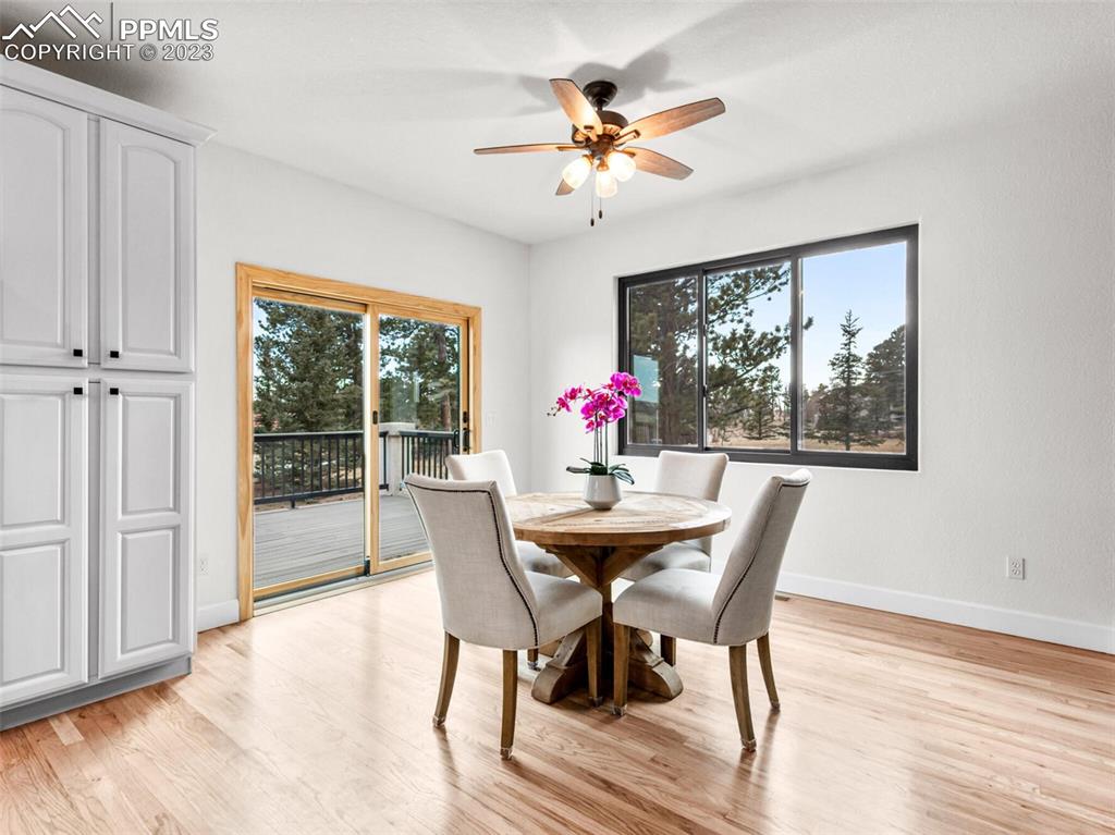 133 Matthew Road Divide, CO 80814 - Photo 6 of 37 a dining room with furniture a window and wooden floor