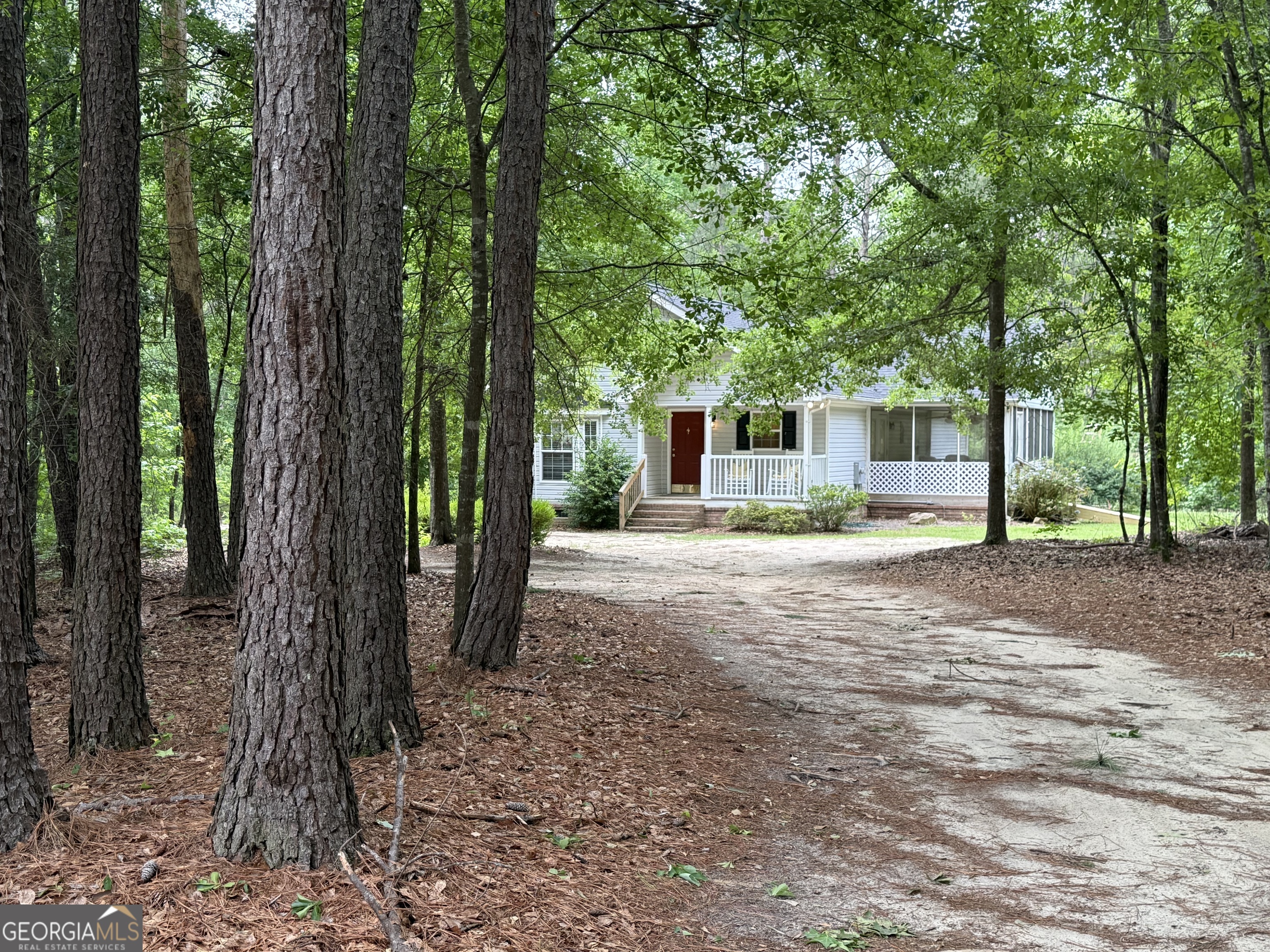1081 Marshall Church Road Thomson, GA 30824 - Photo 25 of 26 a front view of a house with a yard and tree s