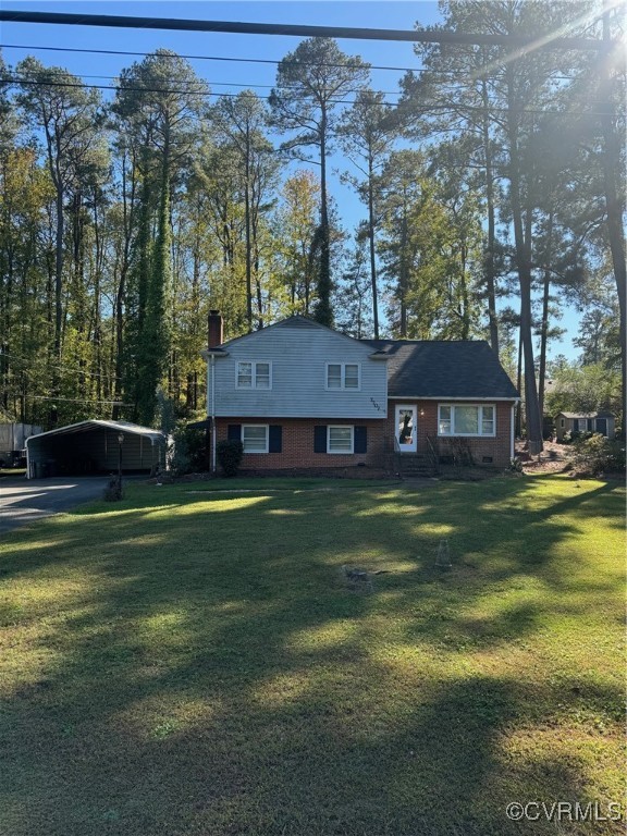 7707 Anoka Road Henrico, VA 23229 - Photo 1 of 21 Split level home featuring a front lawn