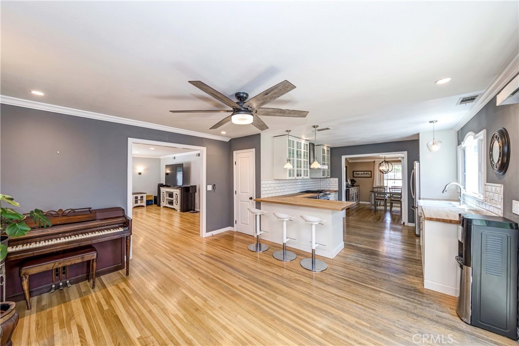 2175 Calavera Place Fullerton, CA 92833 - Photo 11 of 51 a living room with furniture a piano and a flat screen tv