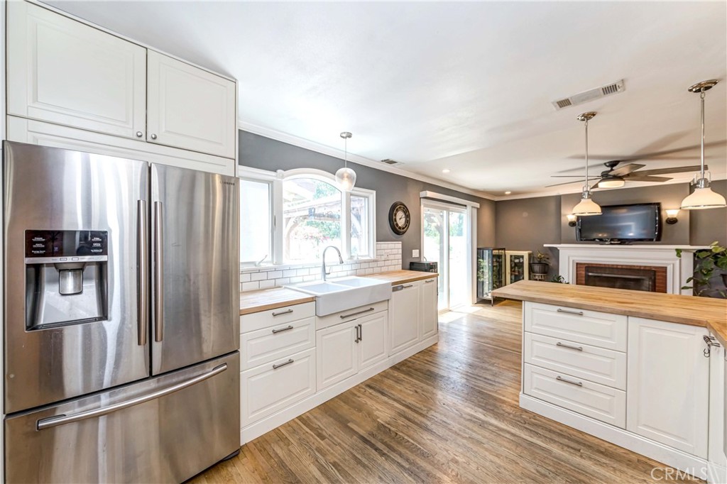 2175 Calavera Place Fullerton, CA 92833 - Photo 12 of 51 a kitchen with stainless steel appliances a refrigerator sink and cabinets