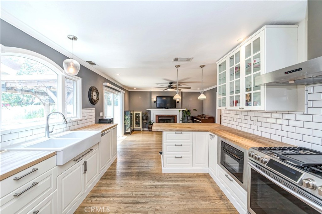 2175 Calavera Place Fullerton, CA 92833 - Photo 13 of 51 a large kitchen with stainless steel appliances granite countertop a stove and large window