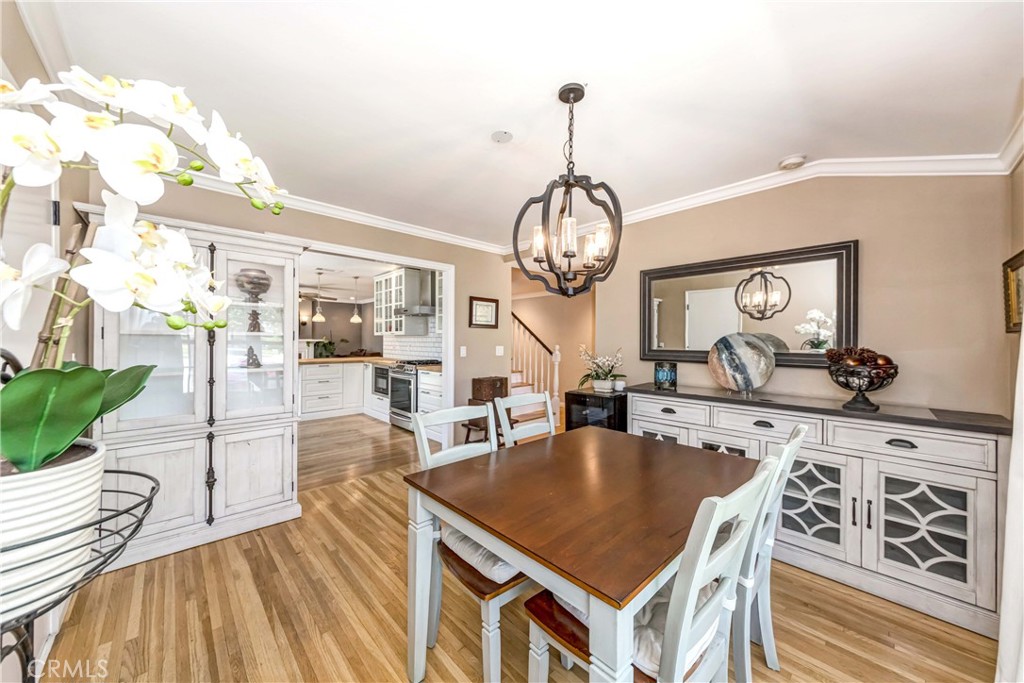 2175 Calavera Place Fullerton, CA 92833 - Photo 16 of 51 a view of a dining room with furniture wooden floor and chandelier