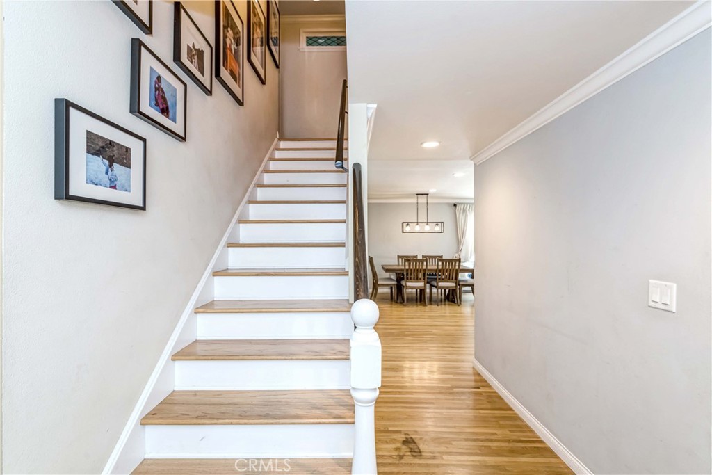 2175 Calavera Place Fullerton, CA 92833 - Photo 21 of 51 a view of staircase with lots of frames on wall and a large window