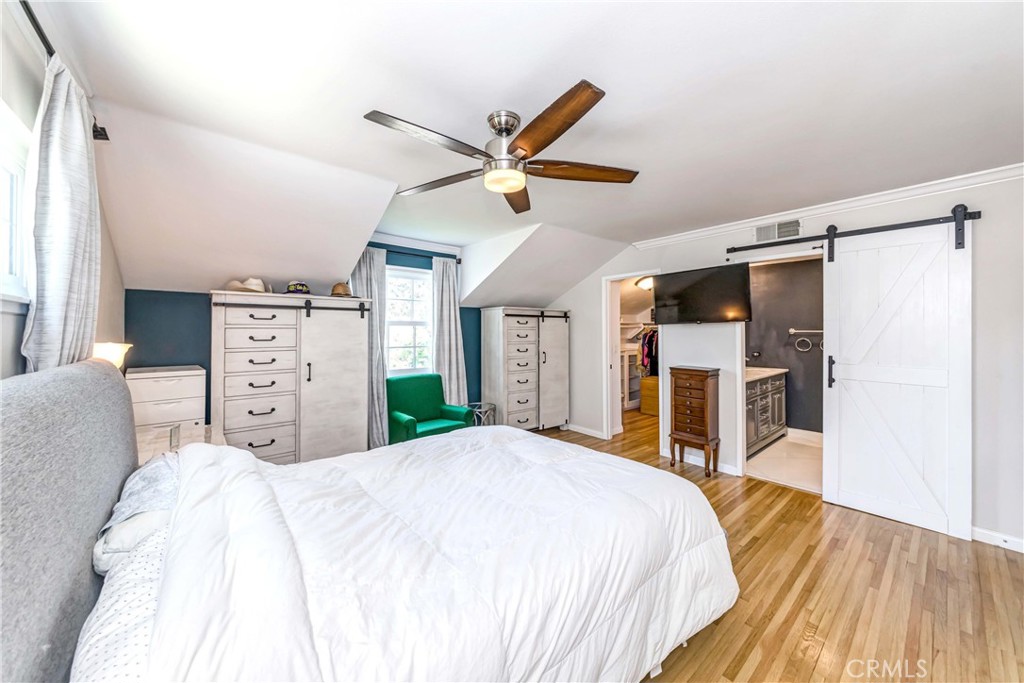 2175 Calavera Place Fullerton, CA 92833 - Photo 25 of 51 a bed room with a bed and a ceiling fan