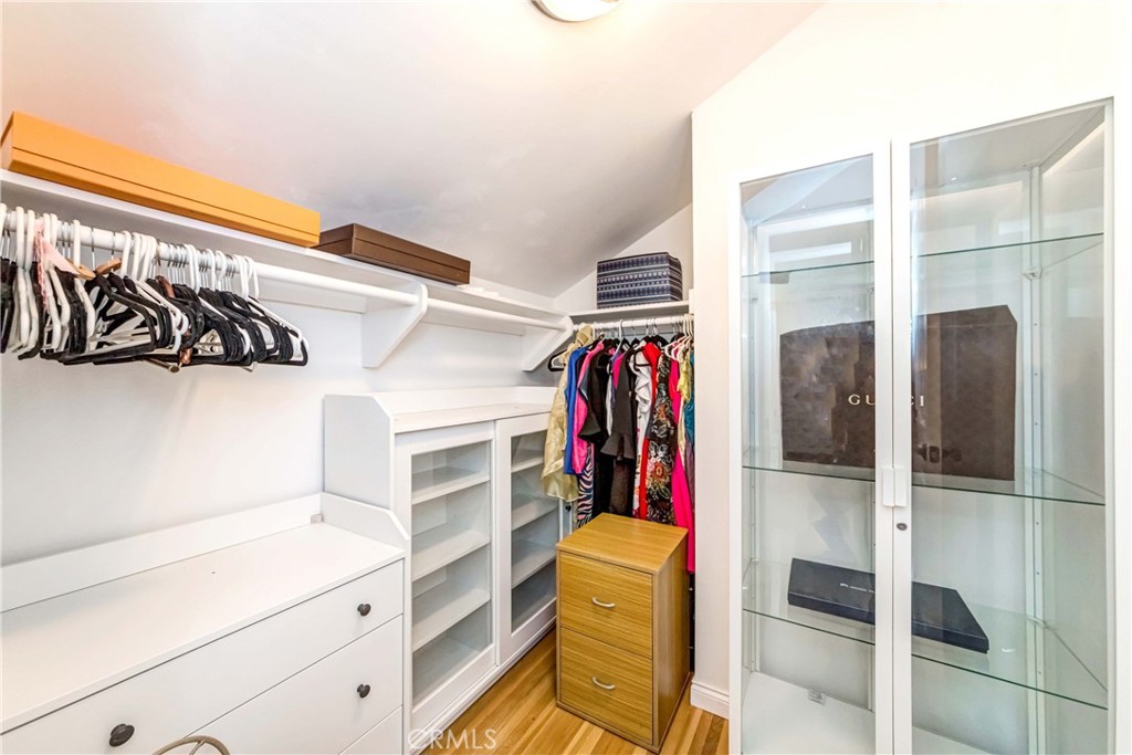 2175 Calavera Place Fullerton, CA 92833 - Photo 27 of 51 a view of walk in closet with clothes and shoes