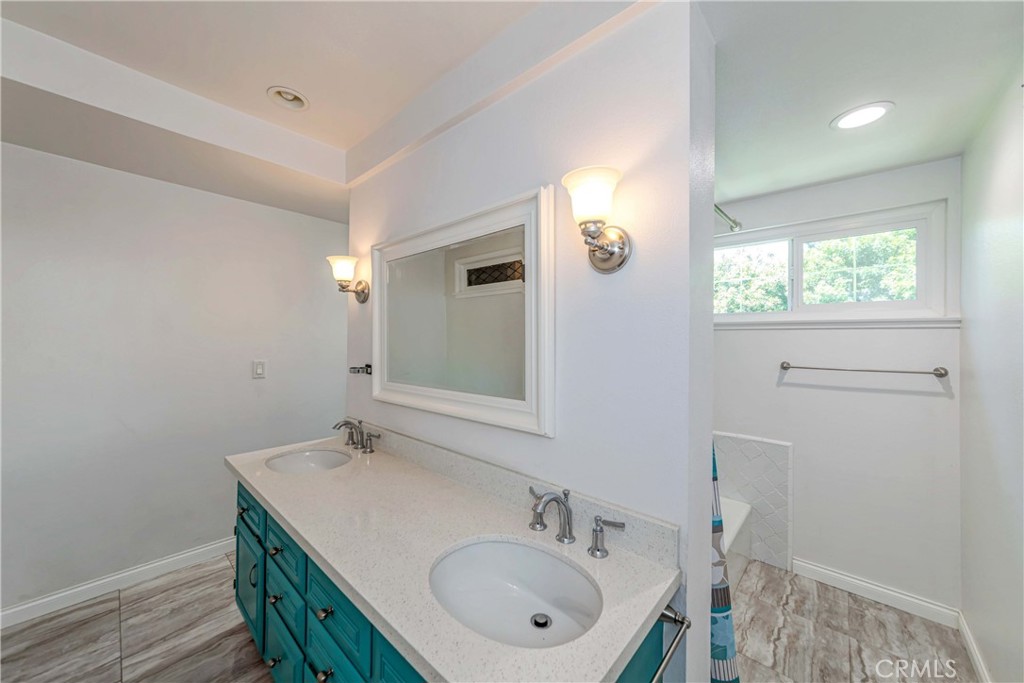 2175 Calavera Place Fullerton, CA 92833 - Photo 35 of 51 a bathroom with a sink a vanity and a mirror