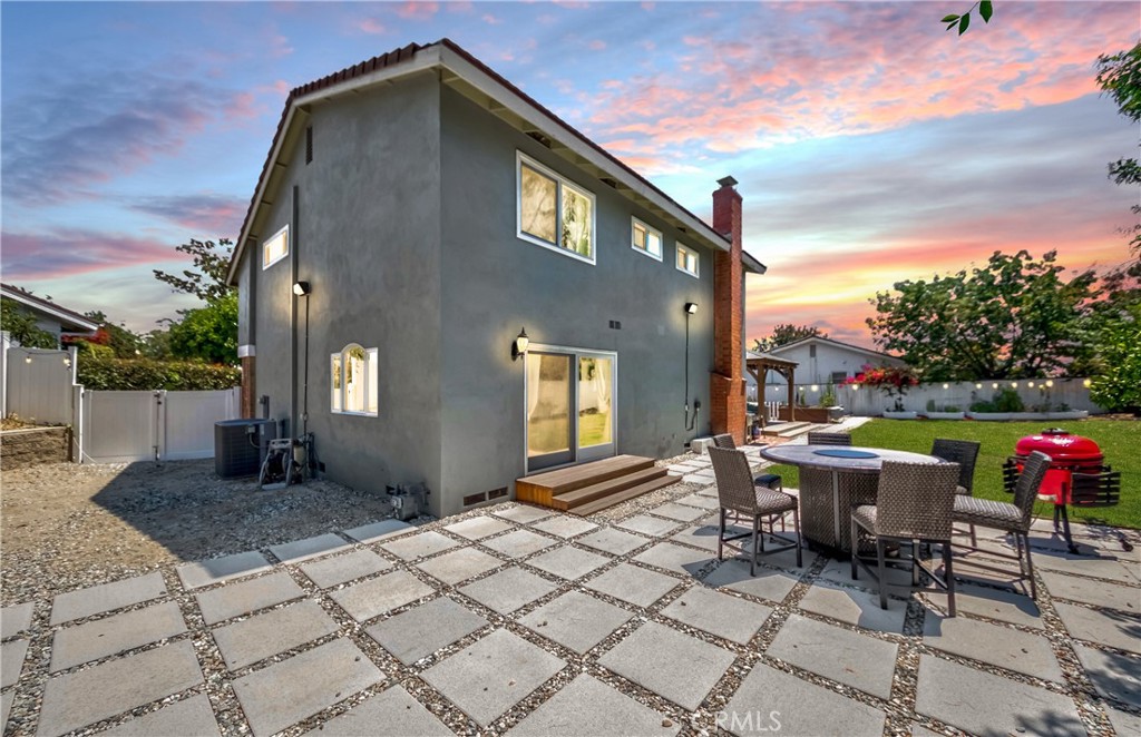 2175 Calavera Place Fullerton, CA 92833 - Photo 44 of 51 a view of a patio with table and chairs and a barbeque