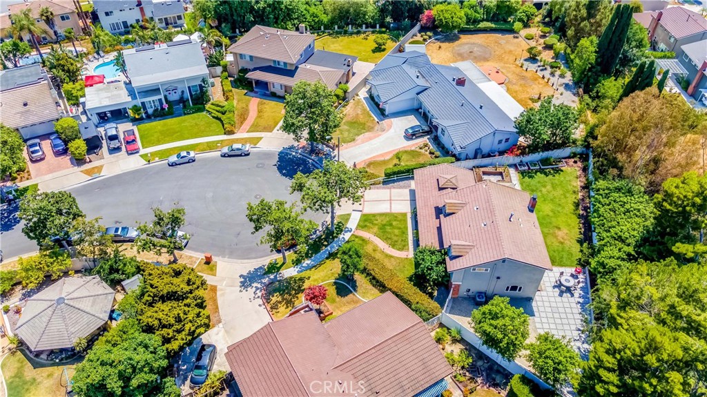 2175 Calavera Place Fullerton, CA 92833 - Photo 49 of 51 an aerial view of a houses with swimming pool and a yard