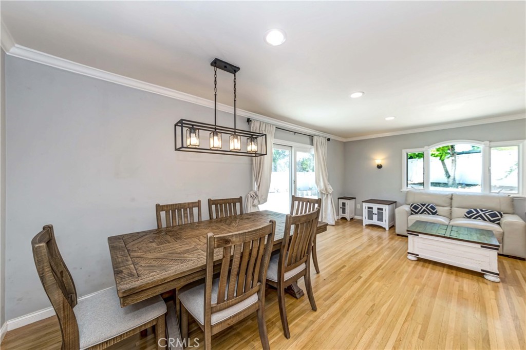 2175 Calavera Place Fullerton, CA 92833 - Photo 8 of 51 a view of a dining room with furniture wooden floor and chandelier