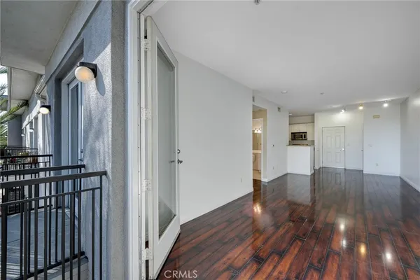 a view of hallway with wooden floor