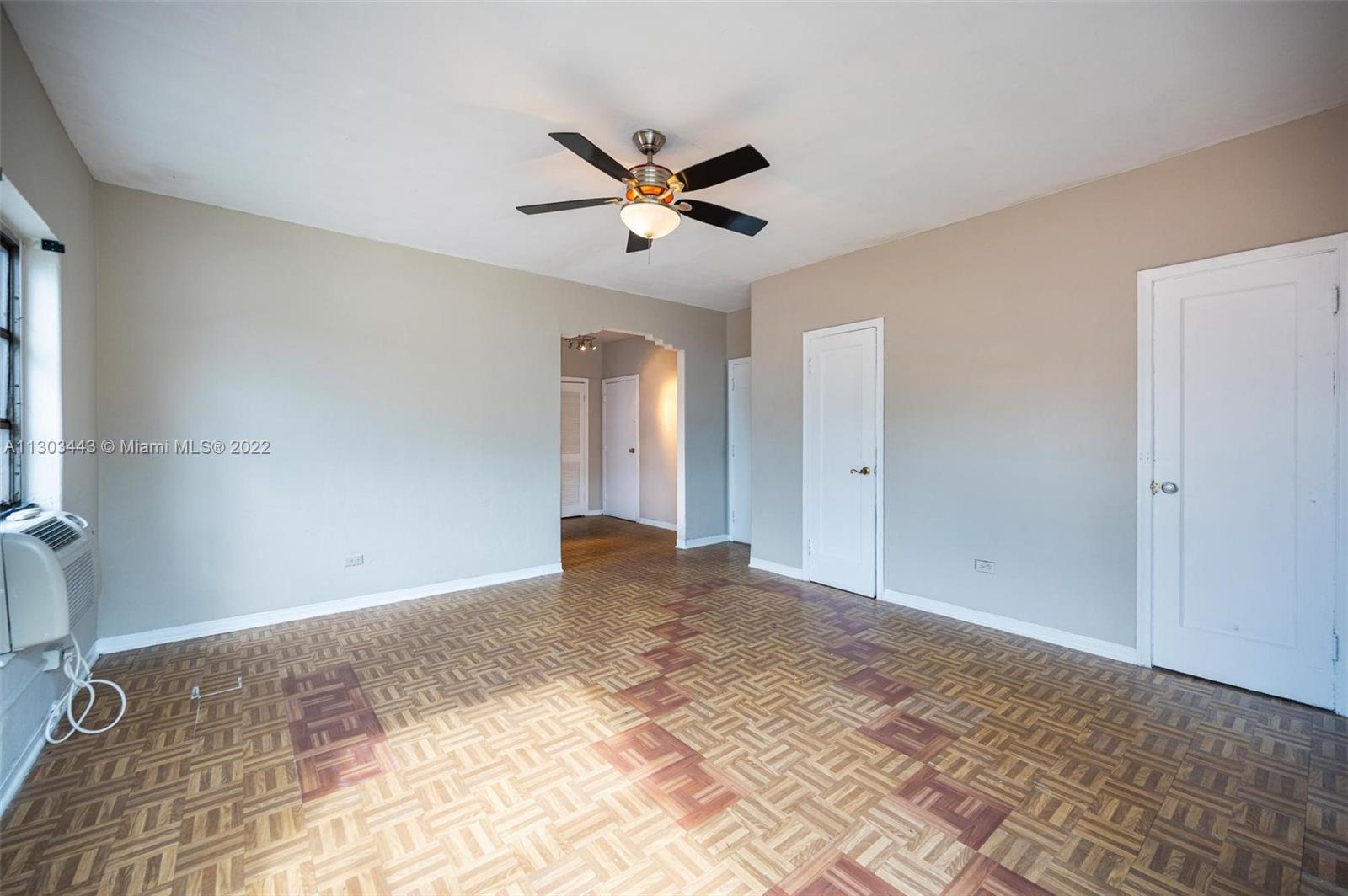 825 Alton Road, Unit 7 Miami Beach, FL 33139 - Photo 4 of 8 a view of empty room with ceiling fan