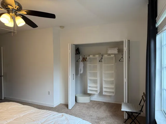 a view of a room with a wardrobe space