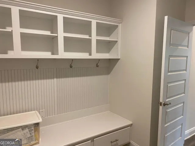 a bathroom with a bathtub and a window